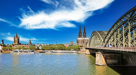 Cologne (Köln), Germany - June 6. 2023: Beautiful rhine river city skyline, two churches, old...