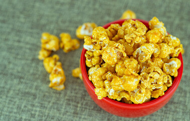 Bowl with delicious caramel popcorn. Homemade Fresh Popped Caramel PopCorn. Sweet caramel flavoured popcorn in bowl.