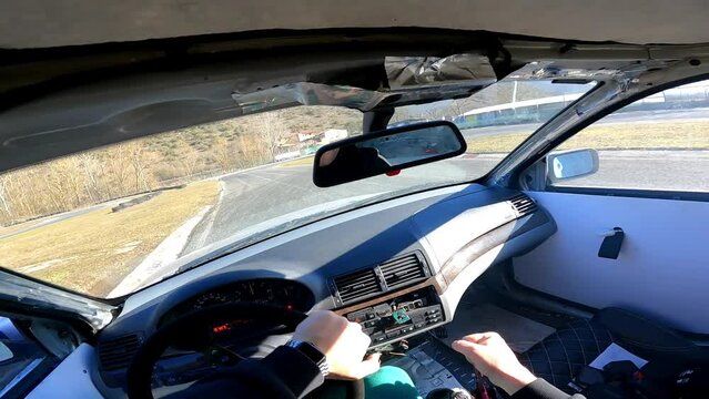 View from inside the drifting car while skilled driver steering wheel and doing drifting maneuvers, drifting techniques and acceleration in drift competitions, motorsport concept