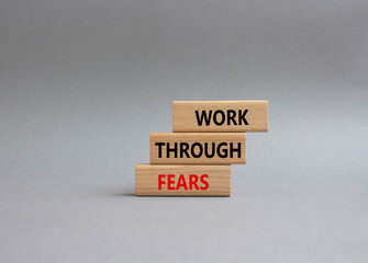 Work through fears symbol. Wooden blocks with words Work through fears. Beautiful grey background. Business and Work through fears concept. Copy space.