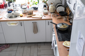 A mess in the kitchen, dirty dishes on the table, scattered things, unsanitary conditions. kitchen...