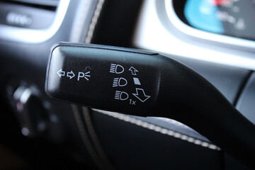 Car light switch. Car interior with light switch. Car front headlight headlamp control stick on the...
