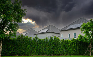 Solar panels on the roof of a modern housing estate Solar panels appears on the roof of a suburban...