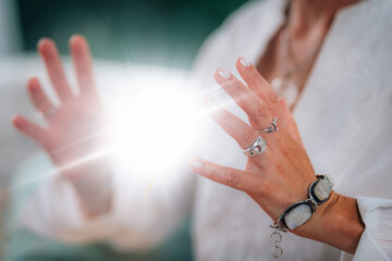 Radiating spiritual energy. Spiritual teacher radiates a luminous, glowing energy ball in between...