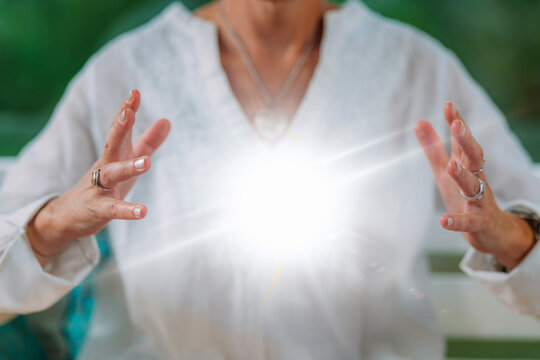 Spiritual enlightenment. Enlightened spiritual teacher emits glowing energy ball