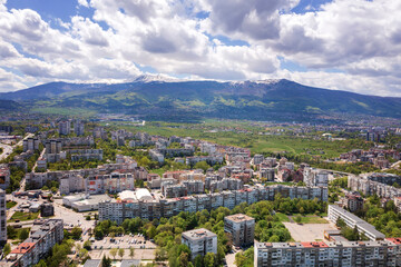 Fototapeta na wymiar Aerial view from a drone of a city next to the mountain, Sofia ,Bulgaria