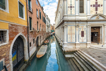 Fototapeta na wymiar The canal in Venice near the church, Italy, Europe.