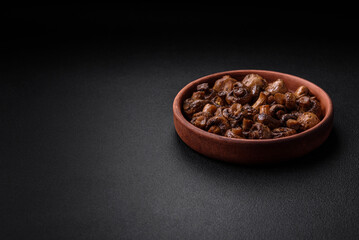 Delicious champignon mushrooms with salt, spices and herbs