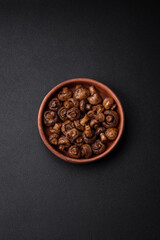 Delicious champignon mushrooms with salt, spices and herbs