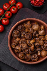 Delicious champignon mushrooms with salt, spices and herbs