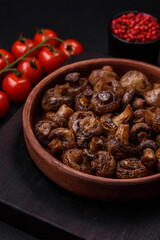 Delicious champignon mushrooms with salt, spices and herbs