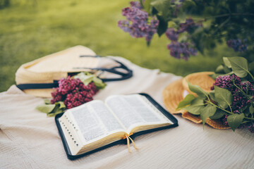 Open bible in the garden, christian concept