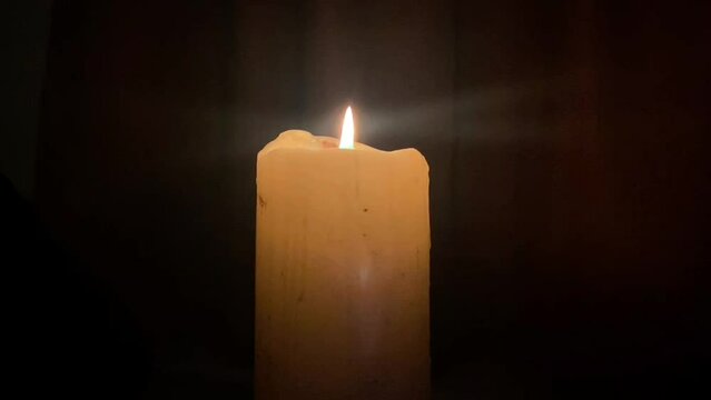 candle being blown out at night background copy space
