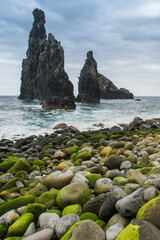 beach with colorful rocks and cliffs in the sea