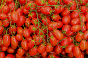 Background of fresh juicy ripe tomatoes, top view.