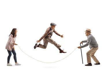 Young woman and older men playing skipping rope