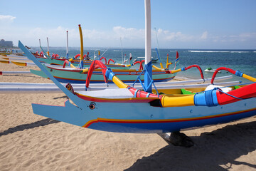 Traditional filing boats on the Bach at Sanur. Bali. Indonesia.