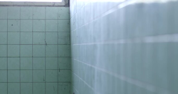 The camp and the corner of the room of the premises of the old psychiatric hospital. Glare of light on the surface. A safe place to hold patients with a mental disorder.