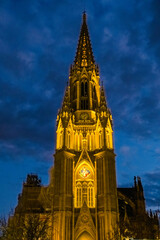 Fototapeta premium The cathedral of San Sebastian is illuminated at night in a ghostly way.