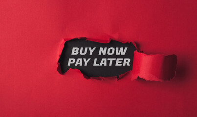 text buy now pay later on torn paper