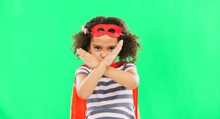 Superhero, child and stop sign on green screen with hands to fight crime with fantasy or cosplay...