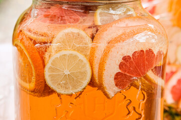lemonade cocktail cool drink from orange and grapefruit in a glass jar