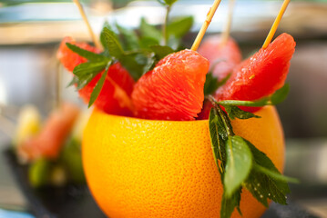 food for a buffet table, for cocktails, lime cheese, grapefruit with mint for a diet