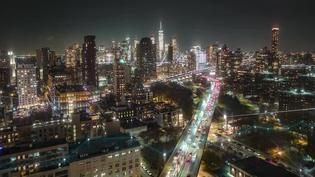 Aerial panoramic hyper lapse footage of night metropolis. Heavy traffic on multilane expressway. Digital lines and charts, analysing collected data visual effects. New York City, USA