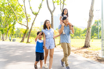 Happy Asian family spending time together travel on summer holiday vacation. Parent and little...