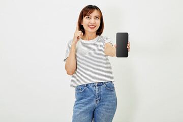 Cute asian short brunette hair woman promotes smartphone app, woman blogger showing personal social media page hold phone look camera happily smiling on white background