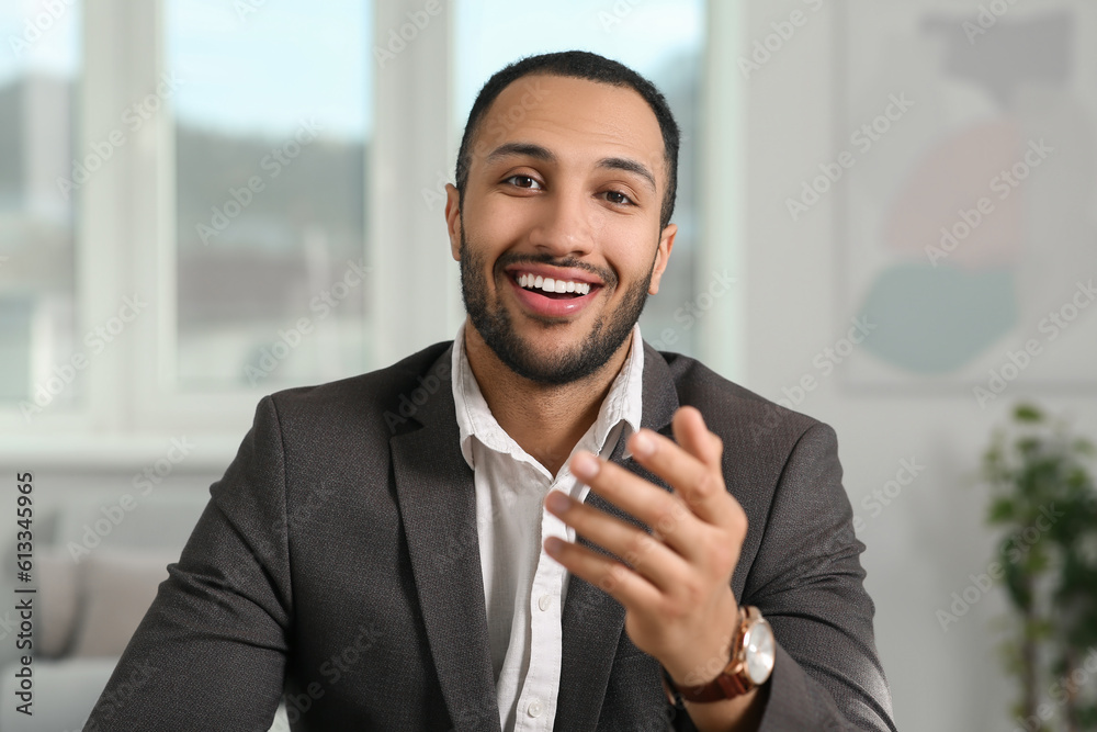 Sticker Young man having online video call at home, view from camera