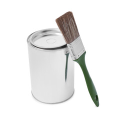 Can of paint and brush on white background