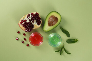 Flat lay composition with homemade cosmetic products and fresh ingredients on light green background. DIY beauty recipe