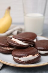 Tasty sweet choco pies on table, closeup