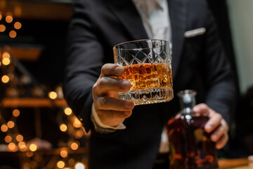  Barman pouring whiskey whiskey glass celebrate whiskey on a friendly party in  restaurant