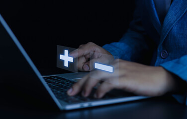 Businessman showing plus and minus signs with positive or negative business decisions, comparative analysis of advantages and disadvantages.