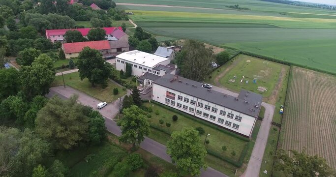 A school in the countryside built during the communist era. Dynamic drone footage 4K.