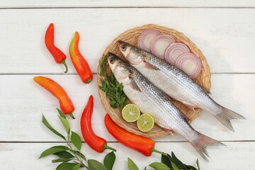Buri, mullet fish, in a basket, on the table, white background, fresh seafood, background image