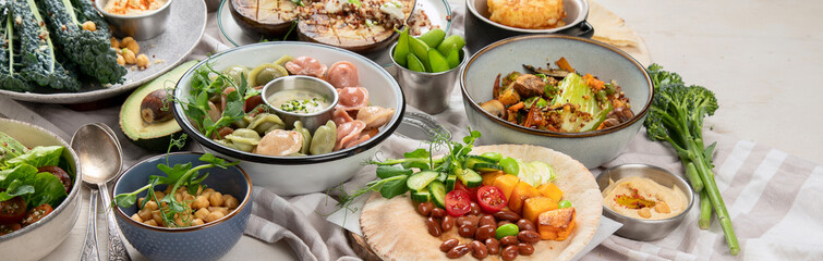 Vegetarian and various vegan dishes on light table. Healthy food concept with vitamins, fiber and antioxidants.
