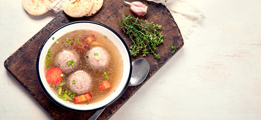 Knodel soup bowl and bread