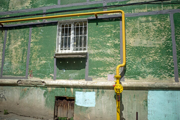 Fragment of the facade of an old residential building on a summer day