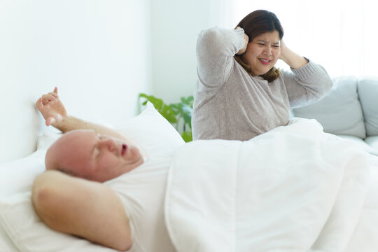 Wife angry her husband about snoring loudly when sleeping.