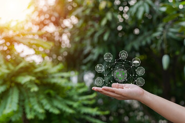 Technology, hand holding with environment Icons over the Network connection on green background.