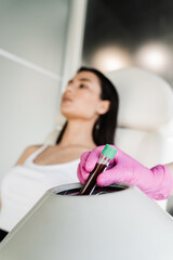 Close-up inserting test tube with blood in centrifuge to get plasma of patient girl for PRP...