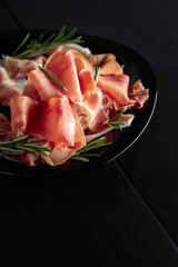 Italian prosciutto or Spanish jamon with rosemary.