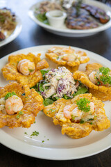 Fried plantain shrimp baskets with some salad