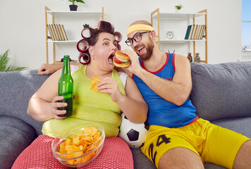 Funny man and chubby fat glutton woman in hair curlers have cheat day together, stop caring about...