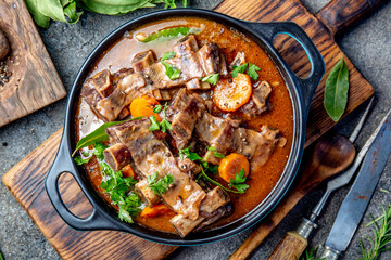 Beef ribs Bourguignon. Beef ribs stewed with carrot, onion in red wine. France dish