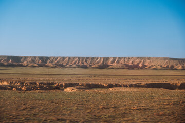 cloudless sunny morning in the Kazakh steppe with hills