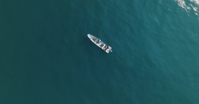 Aerial Top Down Slow Motion Drone view of Small Fishing Boat at El Tunco El Salvador